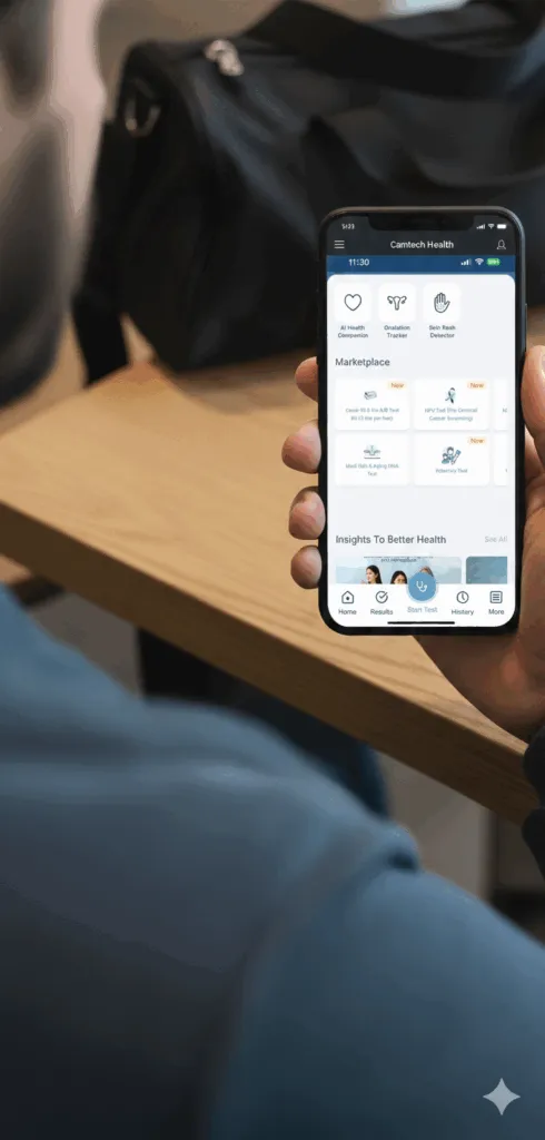 Close-up of a user holding a smartphone displaying the Camtech Health app interface, featuring digital health tools for HPV screening, AI health tracking, and diagnostic tests.